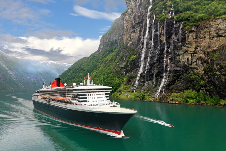The Queen Mary 2 makes its way through Geiranger Fjord in Norway.